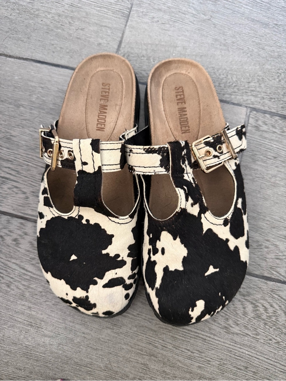 Steve Madden Kids Black and White Cow Print Slip-On Clogs with Gold Buckle